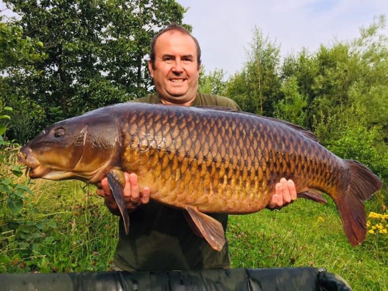 Mark Cunliffe with a mirror carp weighing 42 lb 8 oz