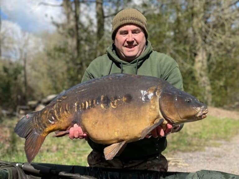 Mark Cunliffe with a mirror carp weighing 38 lb 2 oz